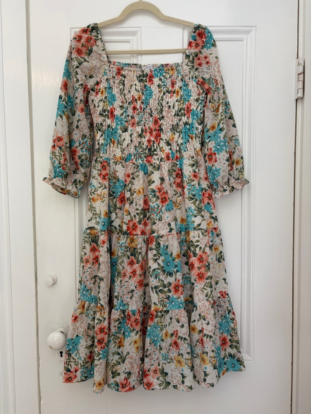 Baltic Born Floral Smocked Cream Dress with Teal and Coral Flowers